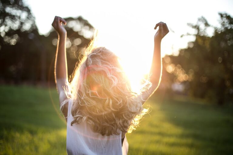 pexels-woman-raising-arms-into-the-sun-852793